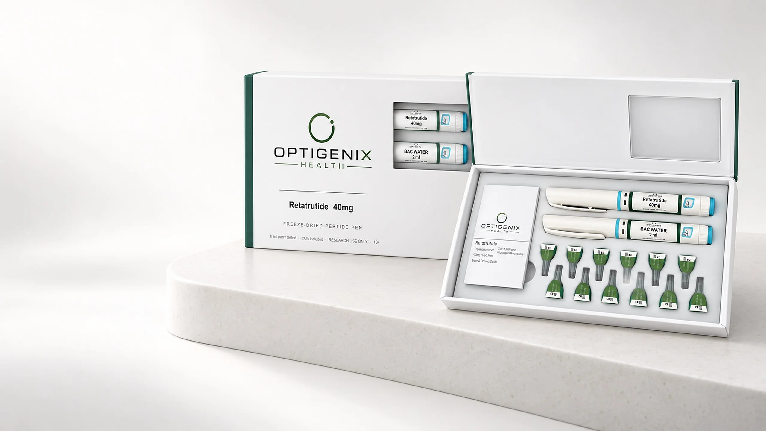 Optigenix Retatrutide 40mg kit, open on a stone plinth, showing the freeze-dried pen and bacteriostatic water pen